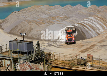 Diggers at Cemex Quarry in Dove Holes  High Peak district of Derbyshire nr Buxton. Stock Photo