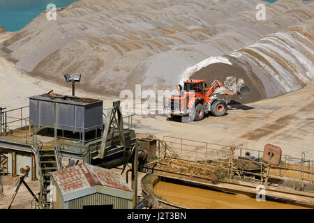 Diggers at Cemex Quarry in Dove Holes  High Peak district of Derbyshire nr Buxton. Stock Photo