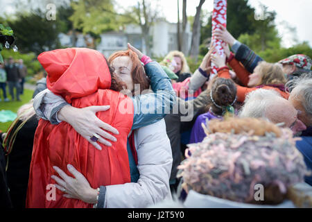 People at Chalice Well, Glastonbury, where Beltane festivities are taking place on May Day. Stock Photo