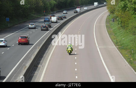 POLICE MOTORCYCLIST RIDER PATROLLING ON THE M54 MOTORWAY IN SHROPSHIRE Stock Photo