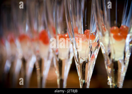 Horizontal close up view of champagne flutes waiting to be filled up with alcohol. Stock Photo