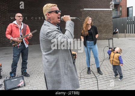 London, UK. 30th April 2017.  Adam Clifford (aka Jimmy Kunt) performs with the help of a young backing vocalist at the Class War protest against gentrification outside Bermondsey's White Cube gallery. There were also performances by Cosmo, Potent Whisper nd others, along with speeches by Simon Elmer of ASH, Martin Wright and Ian Bone. Credit: Peter Marshall/Alamy Live News