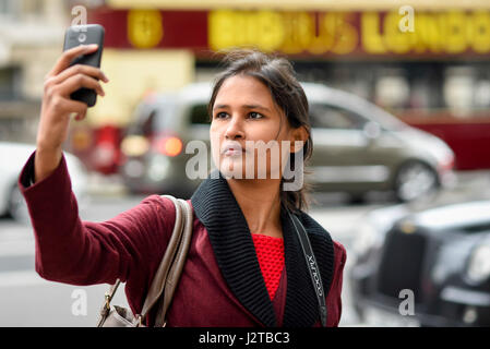 London, UK. 30th Apr, 2017. A tourist takes a selfie of their visit to Whitehall during the early May bank holiday weekend. Sterling's weakening post Brexit continues to attract tourists to enjoy sightseeing and shopping in the capital. Credit: Stephen Chung/Alamy Live News Stock Photo