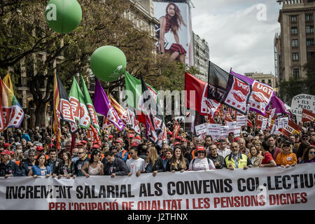 Barcelona, Catalonia, Spain. 1st May, 2017. Thousands of demonstrators with their waving banners march behind their banner during a manifestation organized by the mayor unions CC.OO and UGT, to protest the Troika, the austerity measures and the government under the slogan on 1st of May. Credit: Matthias Oesterle/ZUMA Wire/Alamy Live News Stock Photo