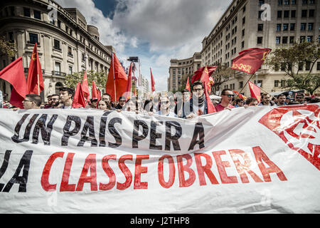 Barcelona, Catalonia, Spain. 1st May, 2017. Communist demonstrators shout slogans during a manifestation organized by the mayor unions CC.OO and UGT, as they march through the city center of Barcelona to protest the Troika, the austerity measures and the government under the slogan on 1st of May. Credit: Matthias Oesterle/ZUMA Wire/Alamy Live News Stock Photo