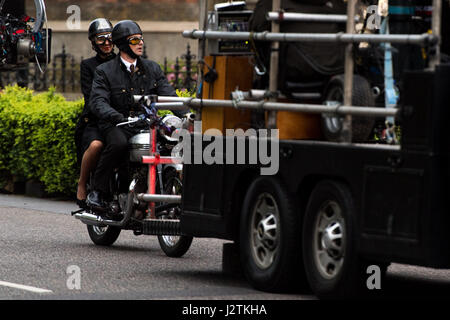 London, UK. 30th April, 2017. Vanessa Kirby (Princess Margaret) and Matthew Goode (Lord Snowdon) filming on a vintage motorbike Credit: Polly Thomas/Alamy Live News Stock Photo