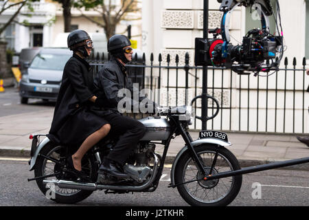 London, UK. 30th April, 2017. Vanessa Kirby (Princess Margaret) and Matthew Goode (Lord Snowdon) filming on a vintage motorbike Credit: Polly Thomas/Alamy Live News Stock Photo