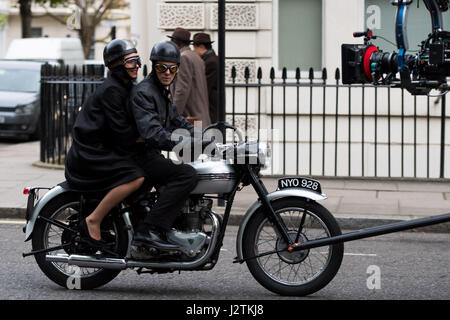 London, UK. 30th April, 2017. Vanessa Kirby (Princess Margaret) and Matthew Goode (Lord Snowdon) filming on a vintage motorbike Credit: Polly Thomas/Alamy Live News Stock Photo