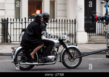 London, UK. 30th April, 2017. Vanessa Kirby (Princess Margaret) and Matthew Goode (Lord Snowdon) filming on a vintage motorbike Credit: Polly Thomas/Alamy Live News Stock Photo