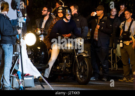 London, UK. 30th April, 2017. Vanessa Kirby (Princess Margaret) and Matthew Goode (Lord Snowdon) filming on a vintage motorbike Credit: Polly Thomas/Alamy Live News Stock Photo