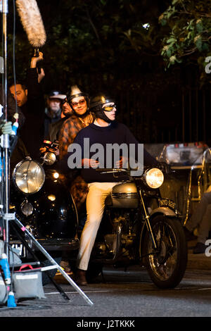 London, UK. 30th April, 2017. Vanessa Kirby (Princess Margaret) and Matthew Goode (Lord Snowdon) filming on a vintage motorbike Credit: Polly Thomas/Alamy Live News Stock Photo