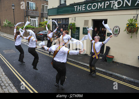 Islington, London, UK. 1st May,  2017. On a slightly damp day, New Esperance Morris dance outside The Compton Arms Pub in Islington, London, United Kingdom to celebrate May Day.  This traditional ritual was mirrored across the UK as on the 1 May, Morris dancers gather to celebrate the first day of summer by dancing.  The tradition of dancing on the first day of summer goes back to pre-Christian pagan times and when Morris dancing became a working class tradition, in the late 16th century, May Day became a core part of their calendar. Credit: Michael Preston/Alamy Live News Stock Photo