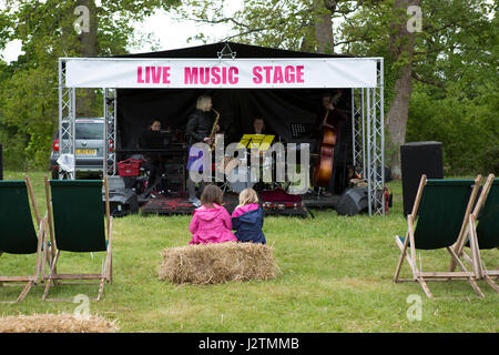 Mapledurham, Oxfordshire, UK . 1st May, 2017.  two young girls enjoying the  Live Music Stage at Mapledurham food festivalCredit: urbanbuzz/Alamy Live News Stock Photo
