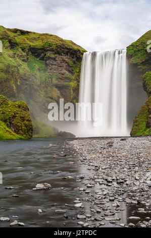 Long exposure of Skogafoss waterfall, Skoga river, mist, nobody, waterfalls of Iceland. Stock Photo