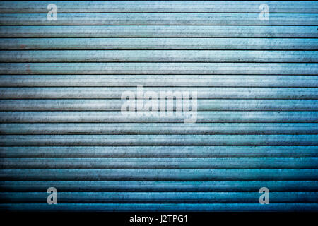 Obsolete planks painted in blue color Stock Photo