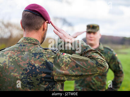 two german soldiers salute each other Stock Photo