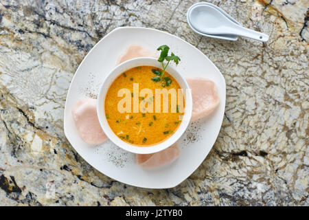 Creamy crab soup on marble background Stock Photo