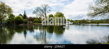 SWINDON, UK - MAY 1, 2017: Boat on the River Thames at Mapledurham Lock near Reading, Berkshire Stock Photo