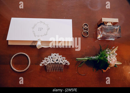lying on the table wedding accessories, card and wedding rings Stock Photo