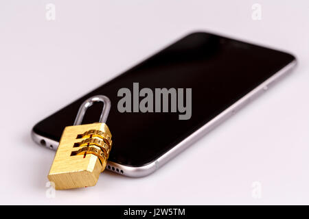 cellphone data security - lock and phone on white Stock Photo