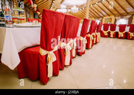 Low angle image of restaurant table setting. Luxury decorated wedding hall Stock Photo
