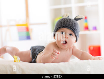 Portrait of a cute 5 months baby wearing rabbit hat Stock Photo