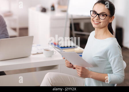 Portrait of smiling female posing on camera Stock Photo