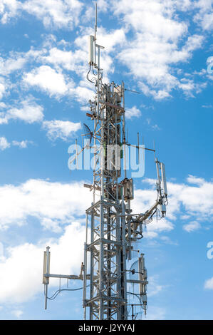 Telecommunication antenna tower against the blue sky Stock Photo