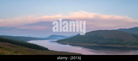 Panoramic view of Loch Loyne in the Scottish Highlands at sunrise with blue sky. Stock Photo