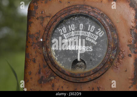 An ammeter gauge on an old tractor. Stock Photo