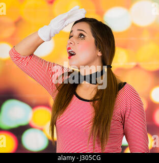 Closeup portrait of cute young girl clown mime looking tired Stock Photo