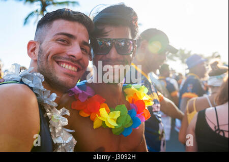 RIO DE JANEIRO - FEBRUARY 11, 2017: Young Brazilian friends celebrate carnival at a street party in Ipanema. Stock Photo
