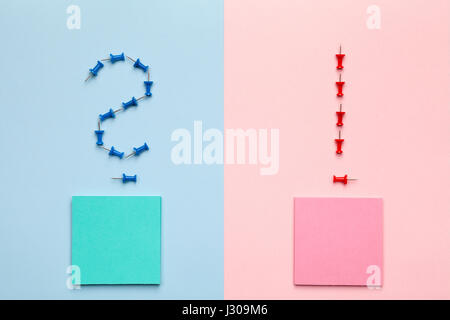 Question and exclamation marks with sticky notes on pastel background. Minimal style. Flat lay. Top view Stock Photo