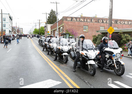 Seattle, USA. 01st May, 2017. Seattle motorcycle police lead the way at the May Day March for Workers and Immigrant Rights through the Central District to Seattle Center. Organizers called for a general strike on International Workers' Day in solidarity with coordinated events in communities in the State of Washington and around the world. Credit: Paul Gordon/Alamy Live News Stock Photo