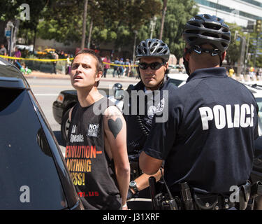 Los Angeles, California, USA. 1st May, 2017. An Anti-Trump protester is arrested near Los Angeles City Hall in downtown Los Angeles, California on May 1, 2017.  Credit: Sheri Determan/Alamy Live News Stock Photo