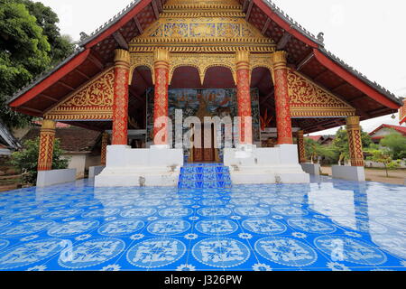 Front stoop of sim-congregation hall of Wat Xang Khong temple. Ban Xang Khong village of the Lu people specialized in silk weaving and saa-traditional Stock Photo