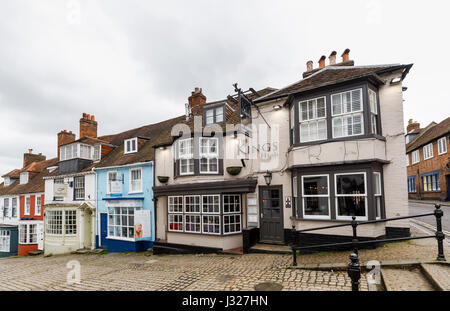 Cobbled Quay Hill with picturesque quaint local shops houses and Kings Head pub leading to Quay Street, Lymington, Hampshire, south coast of England Stock Photo