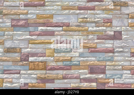 Multi-colored brick wall.Wall of slate. Multi-color old and grunge brick wall. Vintage background. Stock Photo