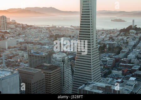 Sunset over Telegraph Hill, Alcatraz Island and San Francisco Bay from the Financial District. Stock Photo