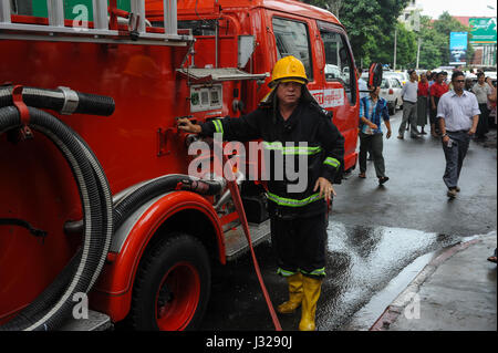 30.07.2013, Yangon, Republic of the Union of Myanmar, Asia - A fire fighter during an emergency operation in the centre of the former capital. Stock Photo