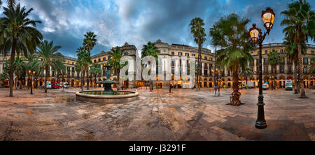 BARCELONA, SPAIN - NOVEMBER 17, 2014: Placa Reial in Barcelona, Spain. The square, with lanterns designed by Gaudi and the Fountain of Three Graces in Stock Photo