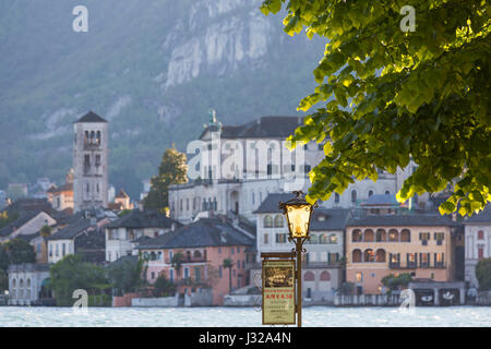 Sign for public services for boats on ornate lamppost at Orta San Giulio, Lake Orta, Italy in April Stock Photo