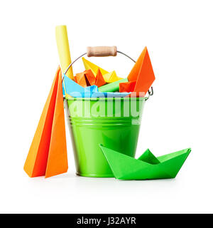 Green bucket with colorful paper sheets and origami toys isolated on white background clipping path included. Children crafts Stock Photo