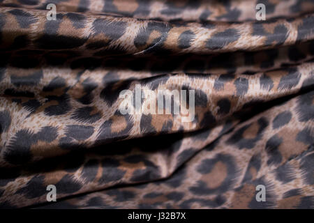 shiny leopard fabric cloth garment textile industry Stock Photo