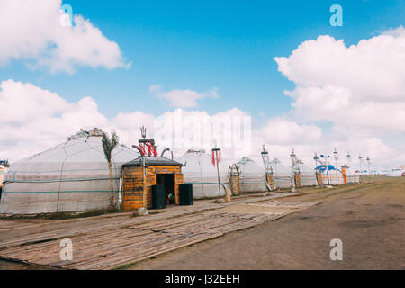 Landscapes of Mongolia, yurts against the backdrop of blue sky Stock Photo