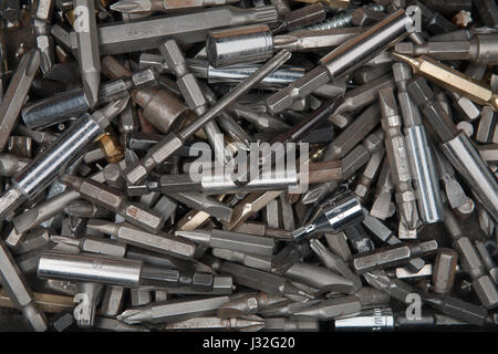 Macro of old rusty used screwdriver bits in a box Stock Photo