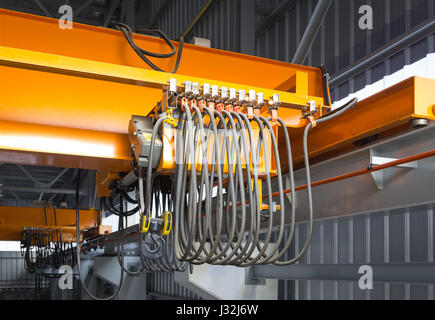 Overhead crane inside industrial building. Bridge crane inside hangar ...