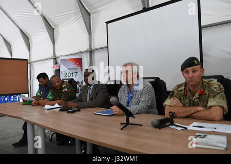 The Special Representative of the Chairperson of the African Union Commission (SRCC) for Somalia, Ambassador Francisco  Madeira (middle), the Head of United Nations Support Office in Somalia (UNSOS), Hubert Price (2nd from right) attend the opening ceremony of a seminar on countering Improvised Explosive Devices (IEDs) in Mogadishu, Somalia on February 6, 2017. AMISOM Photo / Omar Abdisalan Stock Photo