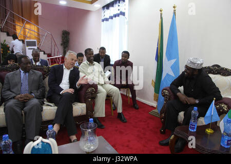 The Special Representative of the UN Secretary-General (SRSG) for Somalia, Michael Keating, (2nd from left) the Special Representative of the African Union Commission Chairperson (SRCC) for Somalia, Ambassador Francisco Caetano Madeira (left) during a meeting with the Jubbaland State President, Ahmed Mohamed Islam Madobe (right) in Kismaayo, Somalia, on February 12, 2017. AMISOM Photo / Barut Mohamed Stock Photo