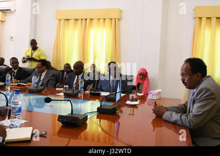 The newly elected President of Somalia, Mohamed Abdullahi Farmajo (right) talks during a meeting with ambassadors from Troop Contributing Countries (TCC) led by the Special Representative of the African Union Commission Chairperson (SRCC) for Somalia, Ambassador Francisco Madeira at Villa Somalia on February 18, 2017.  AMISOM Photo / Ilyas Ahmed Stock Photo